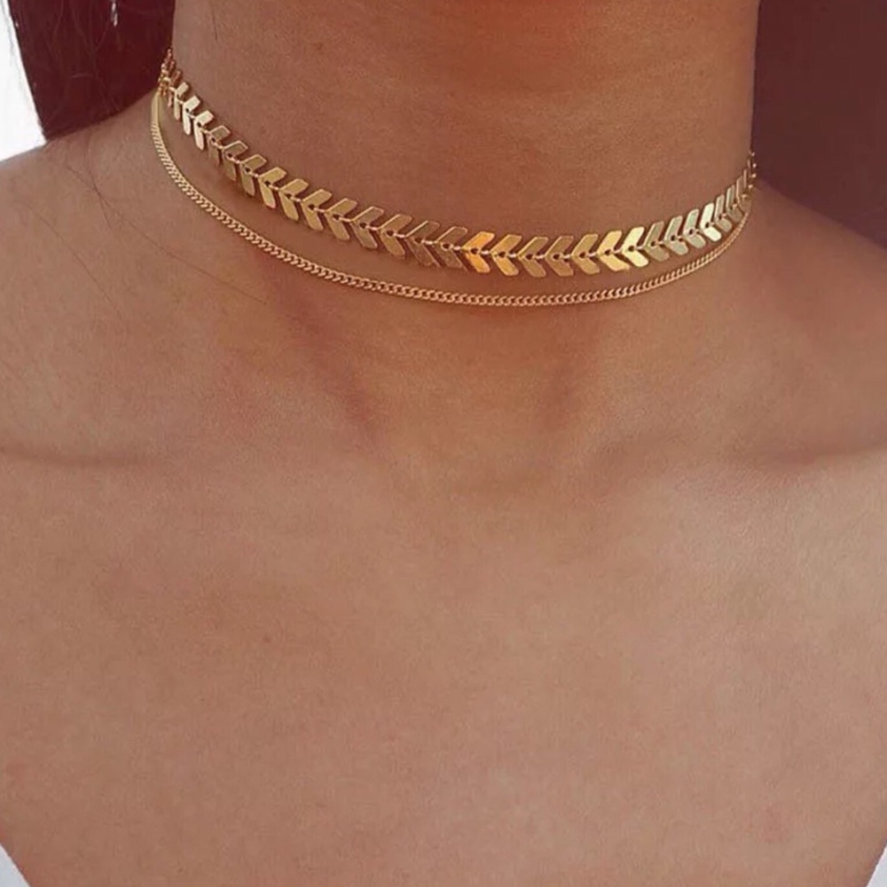 Golden arrow choker necklace.